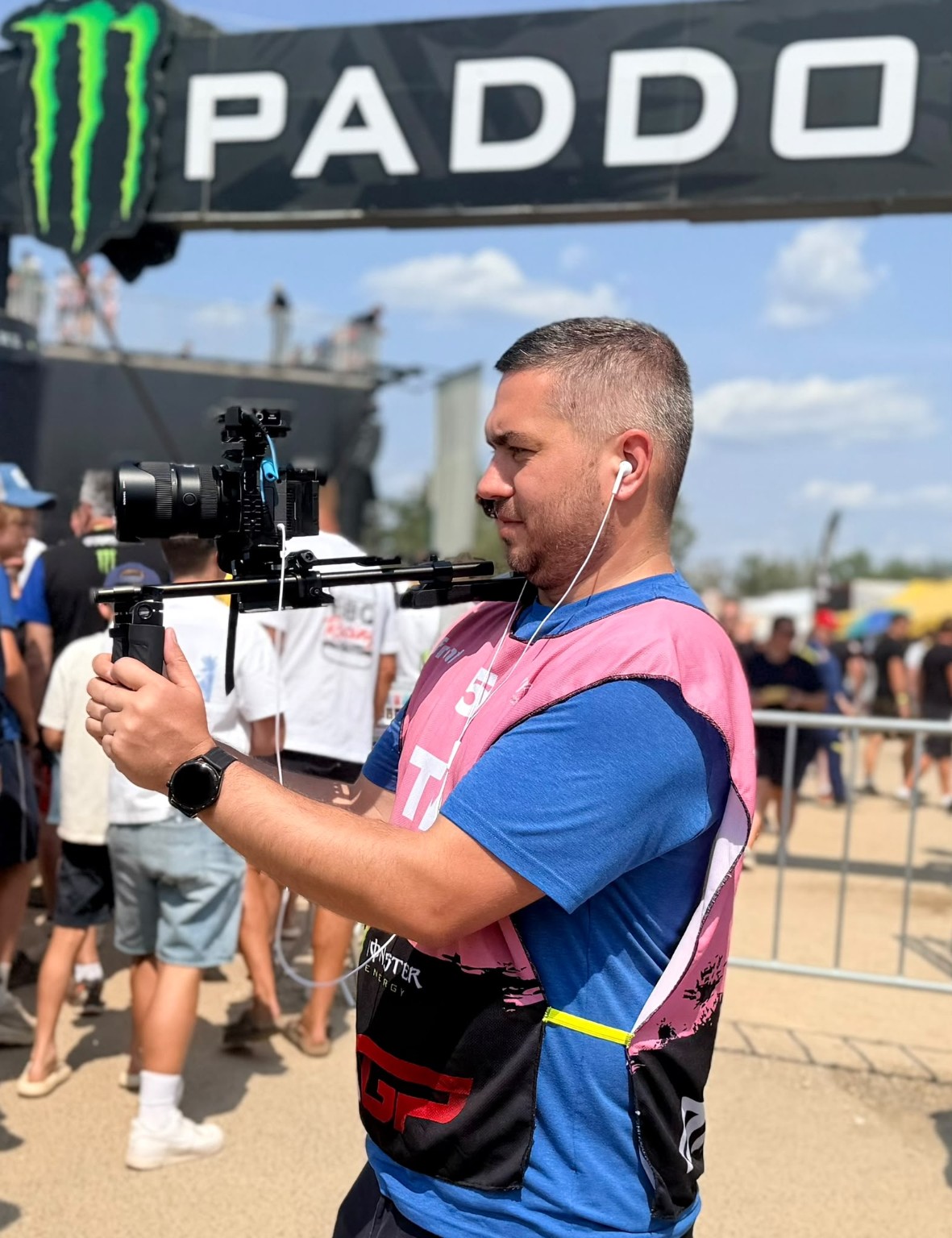GP1 camera operator filming in the motorsport paddock